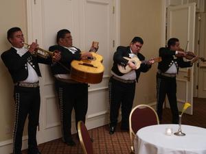 Primary view of object titled '[Mariachi band performing at the TDNA dinner]'.