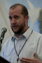Thumbnail image of item number 1 in: '[Man speaking into mic at TDNA conference]'.