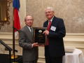 Primary view of [Gary Borders presenting Charles Moser with an award]