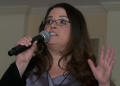 Thumbnail image of item number 1 in: '[Woman speaking into microphone during TDNA conference]'.