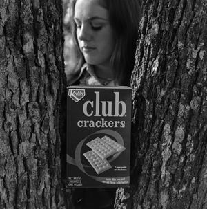 Primary view of object titled '[Club Crackers box in a tree]'.