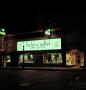 Photograph: [Factory Outlet Shoe Store at night]