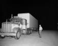 Primary view of [Bill Mack next to large truck]