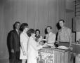 Photograph: [Johnny Hay and Budd Kneisel handing out food]