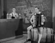 Photograph: [Bob Bohme playing accordion while sitting]