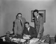 Photograph: [Three men in an office]