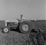 Photograph: [Man on a Ford 4000 tractor]