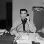 Photograph: [Bill Enis talking on the telephone]