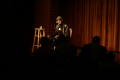 Photograph: [Photograph of director Melvin Van Peebles speaking to an audience]