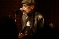 Photograph: [Photograph of Melvin Van Peebles on a stage]