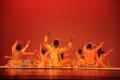 Thumbnail image of item number 1 in: '[Photograph of a group of dancers sitting on stage with their arms raised, 3]'.