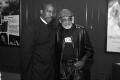 Photograph: [Photograph of Melvin Van Peebles posing for a picture with a man]