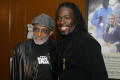 Photograph: [Photograph of Melvin Van Peebles posing with a man at 24-Hour Film F…