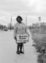 Photograph: [Mattie Nash holding campaign sign, 2]