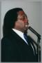 Primary view of [Curtis King addressing guests at Christmas Kwanzaa soiree]