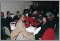 Photograph: [Guests attending the Christmas Kwanzaa soiree]