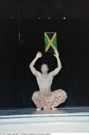 Primary view of object titled '[Male performer dancing at Ashe Caribbean event]'.