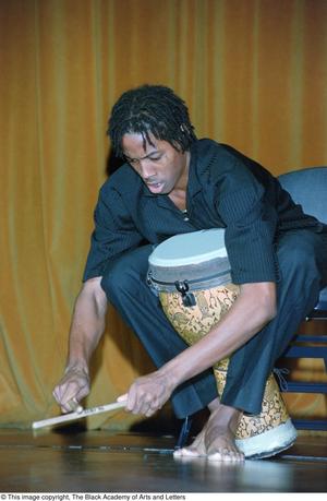 Primary view of object titled '[Percussionist performing at Ashe Caribbean event]'.