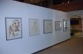 Photograph: [Photograph of an African gallery wall, featuring five art works]