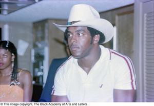 Primary view of object titled '[Photograph of Tony Dorsett in a rancher's hat]'.