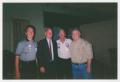 Photograph: [Photo of Howard Dean with three men]