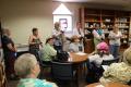 Photograph: [Meghan Harper and attendees in Kent UMC library]