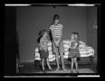 Thumbnail image of item number 1 in: '[Byrd, Carol, and Pam standing in front of a couch]'.