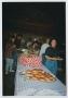 Photograph: [Photograph of TAMS students in a buffet line]