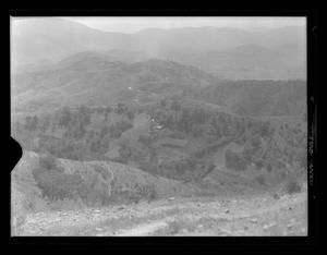 Primary view of object titled '[Hilly area surrounded by mountains]'.
