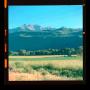 Photograph: [Photograph of mountains behind a field]