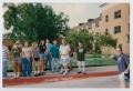 Photograph: [Photograph of TAMS students standing on sidewalk]