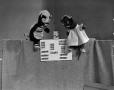 Primary view of [Two puppets and a band-aid box]