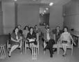 Photograph: [A group gathered in a conference room 1 of 2]