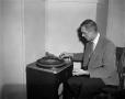 Primary view of [Man working on a record player]