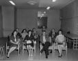 Photograph: [A group gathered in a conference room 2 of 2]
