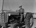 Thumbnail image of item number 1 in: '[Calvin Pigg on a Ford tractor]'.