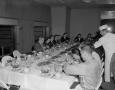Photograph: [People eating at a luncheon]