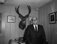 Photograph: [Man with mounted deer]