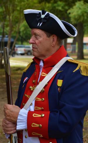 Primary view of object titled '[Compatriot in uniform holding musket at Jester Park]'.