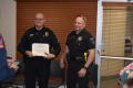 Photograph: [Trevor Clenney and officer at recognition ceremony, February 27, 201…