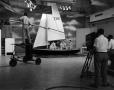 Photograph: [Men filming in a sailboat set]