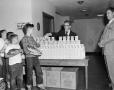 Photograph: [Photograph of children receiving Kellogg's Frosted Flakes]
