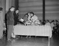 Photograph: [Photo of Margaret McDonald at a table]