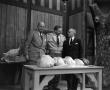 Photograph: [Photograph of Doc Rhuman with guests and turkeys]