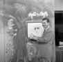 Photograph: [Photograph of Johnny Hay and drawing]