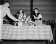 Photograph: [Photograph of Margaret McDonald at a table]