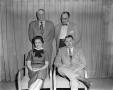 Photograph: [Margaret McDonald posing with three men]