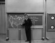Photograph: [Photograph of Larry Morrell and weather board]