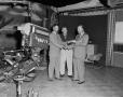 Photograph: [Doc Rhuman with Cal Johnson and TV weatherman]