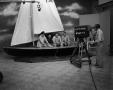 Thumbnail image of item number 1 in: '[Men sitting in a sailboat on set]'.